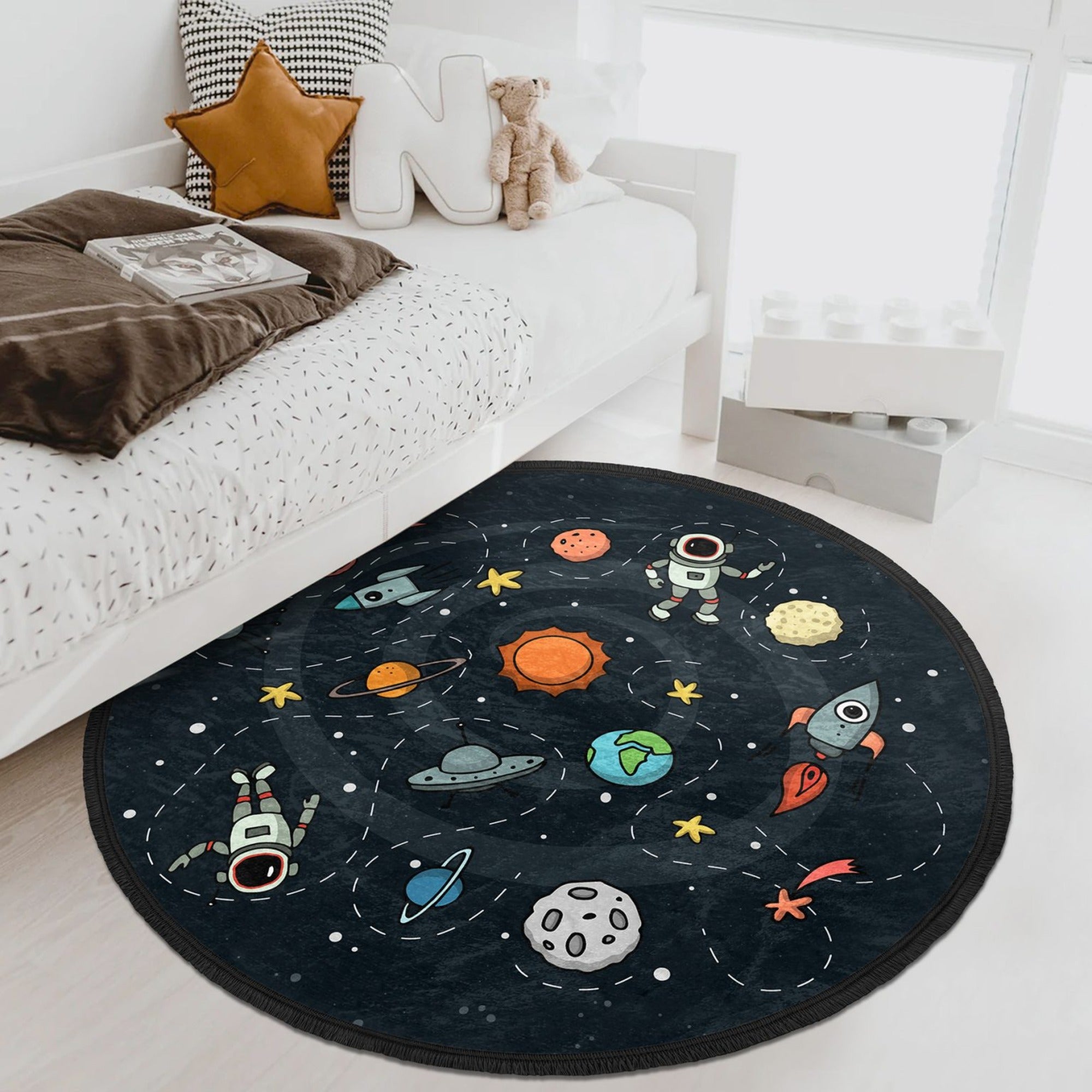 A vibrant universe patterned kids room rug featuring a colorful celestial design, perfect for nurseries and play areas.