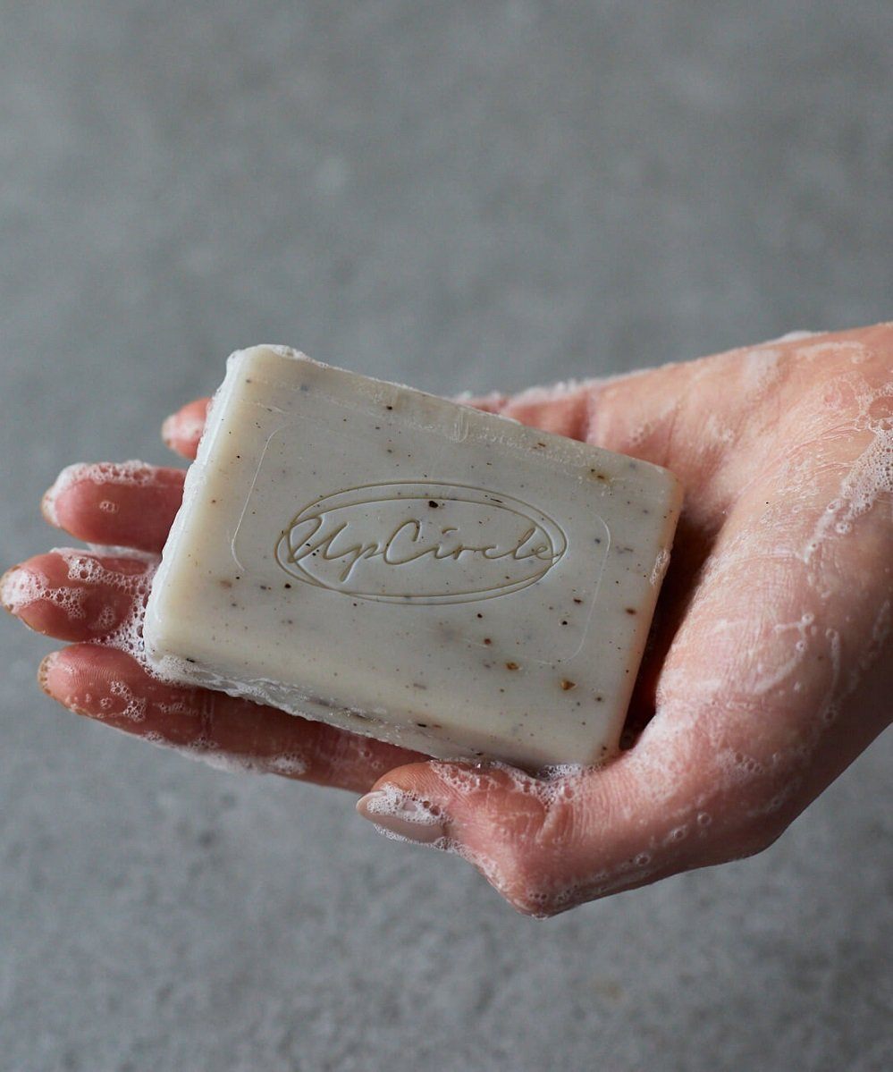 UpCircle Fennel & Cardamom Chai Soap Bar with natural ingredients, showcasing its creamy texture and earthy colors.