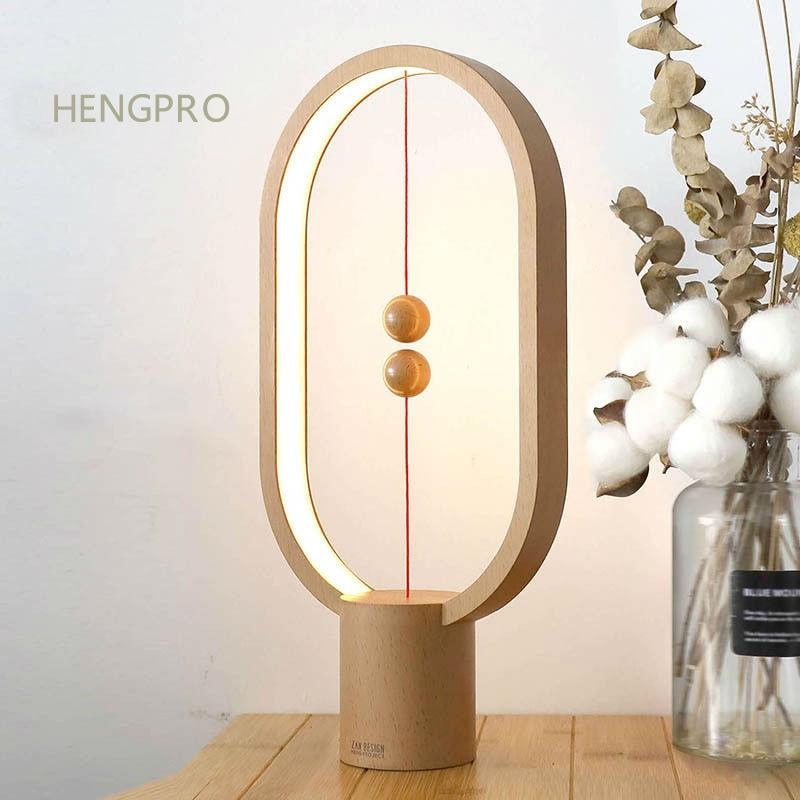 Upgrade HENGPRO Balance Night Light, a portable ellipse-shaped LED lamp with a magnetic mid-air switch, perfect for home decor.