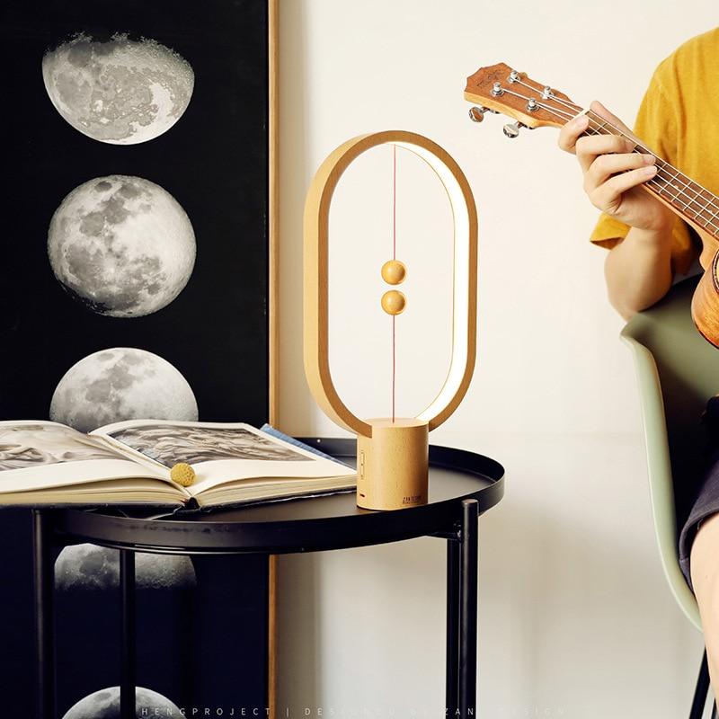 Upgrade HENGPRO Balance Night Light, a portable ellipse-shaped LED lamp with a magnetic mid-air switch, perfect for home decor.