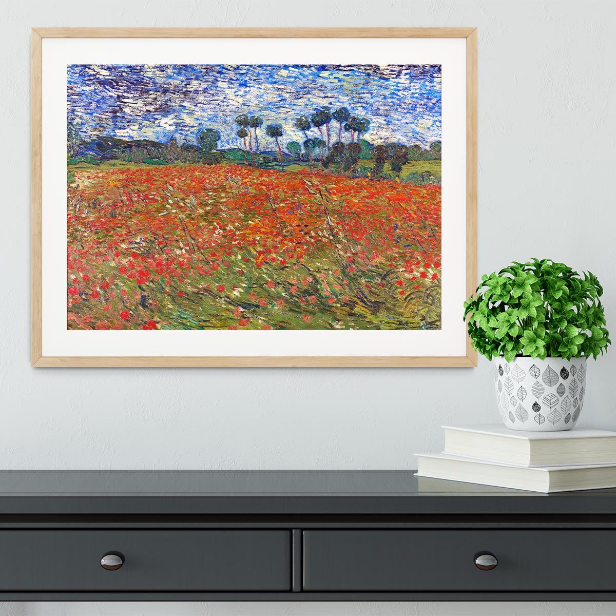 Framed print of Van Gogh's Poppies Field, showcasing vibrant colors and intricate details in a stylish frame.