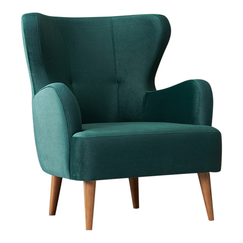 KING Velvet Armchair in cypress green with plush upholstery and walnut-colored beech wood legs, showcasing its elegant design.