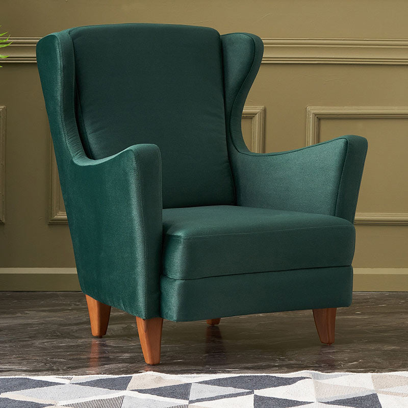 Velvet Armchair LORD in Dark Green, showcasing plush upholstery and elegant design with natural beech wood legs.