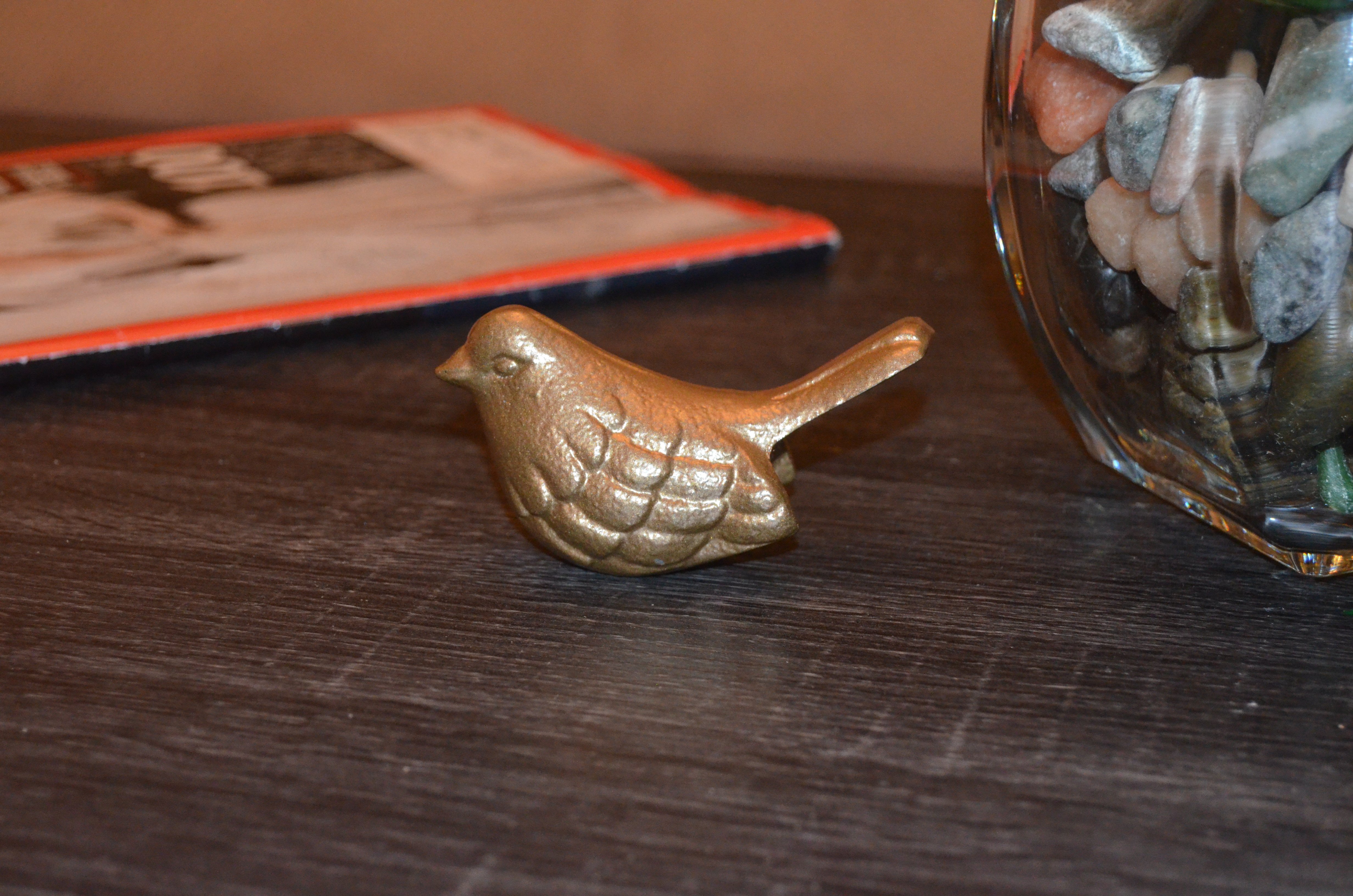 Handcrafted Vibhsa Bird Figurines in marigold color, symbolizing health and happiness, made of aluminum.