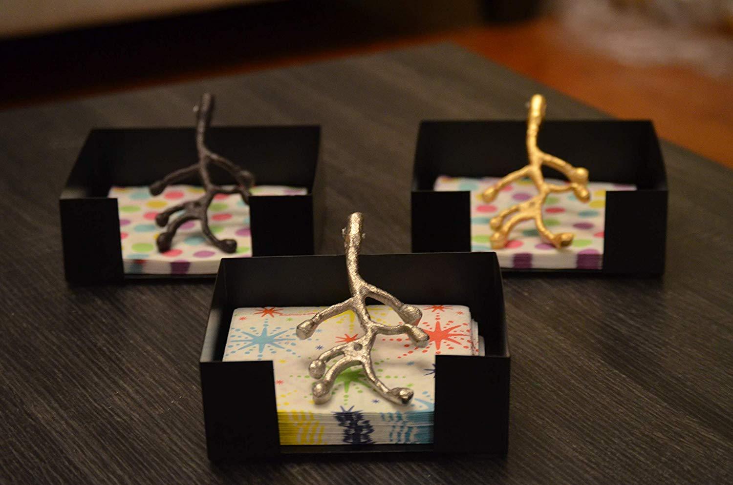 Vibhsa Antique Napkin Holder showcasing handcrafted flower bud design, perfect for dining decor.