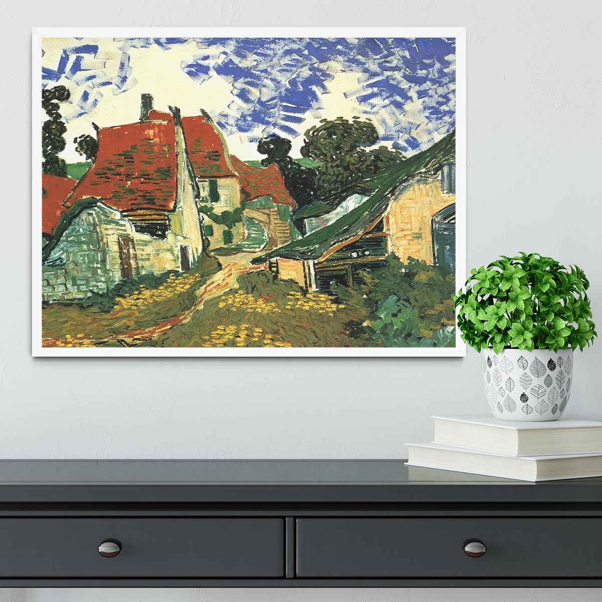 Framed print of Van Gogh's Villages Street in Auvers, showcasing vibrant colors and intricate details in a stylish frame.