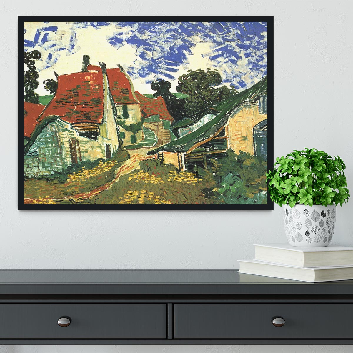 Framed print of Van Gogh's Villages Street in Auvers, showcasing vibrant colors and intricate details in a stylish frame.