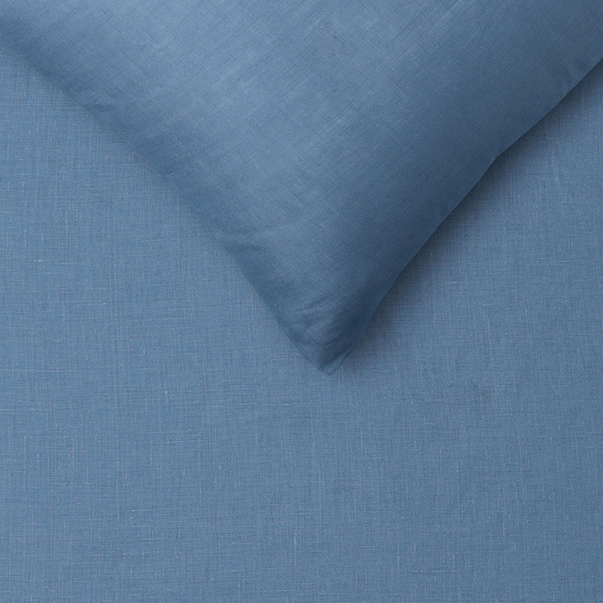 Vintage Design Homewares 100% Linen Brilliant Blue Quilt Cover Set displayed on a neatly made bed, showcasing its elegant color and texture.
