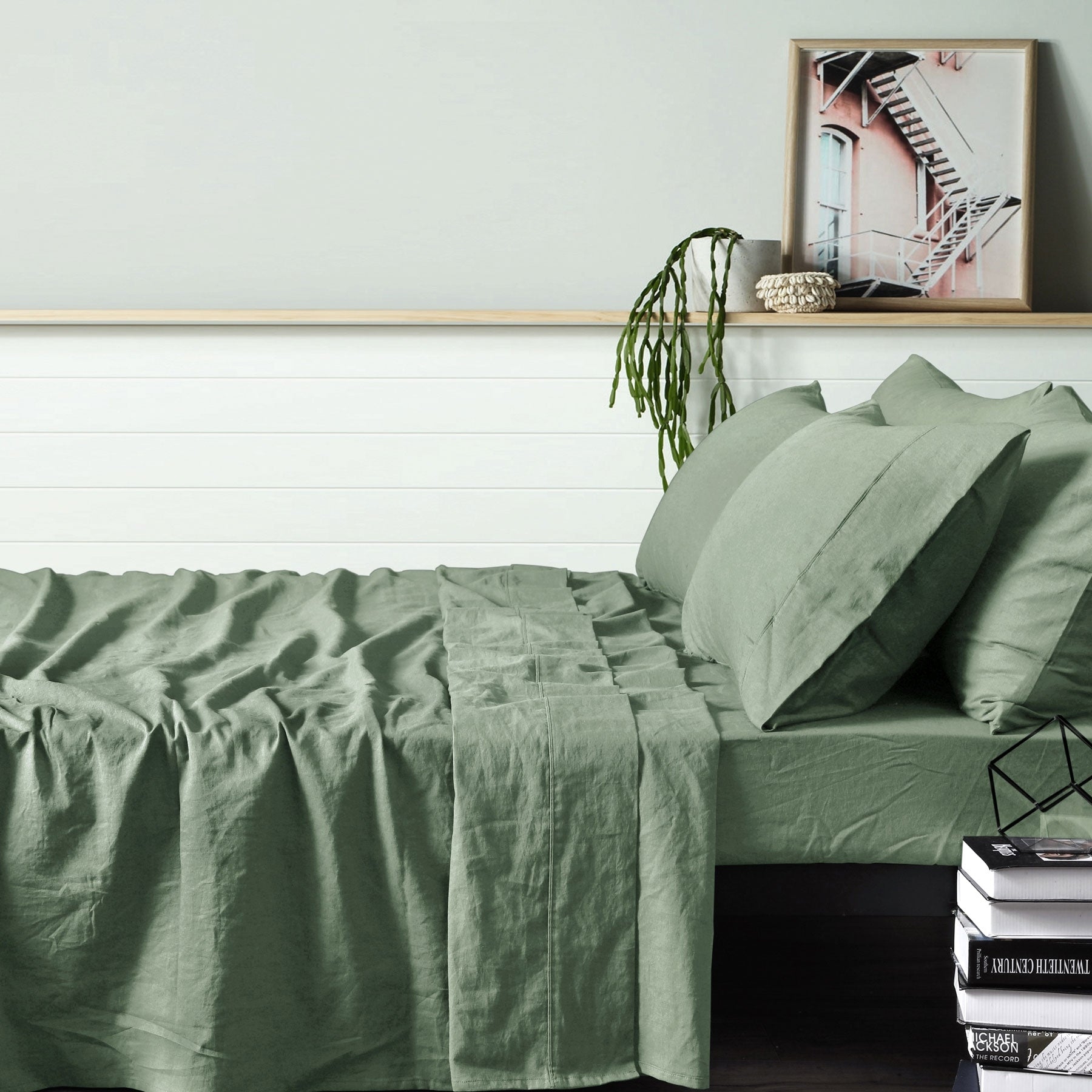 Vintage Design Homewares 100% Linen Sage Sheet Set displayed on a bed, showcasing its elegant sage color and soft texture.