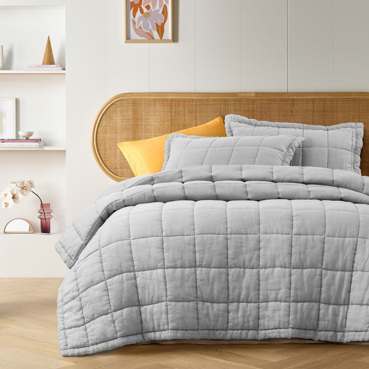 Dove Grey French Linen Coverlet Set featuring a quilted design, including a coverlet and two pillowcases, elegantly displayed on a king-sized bed.