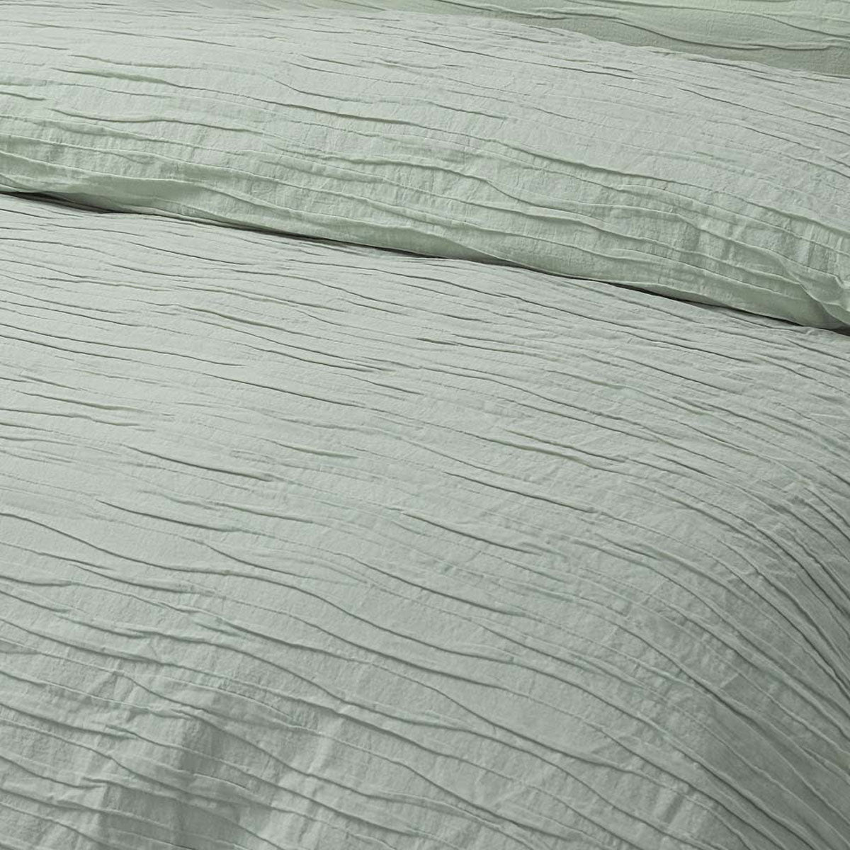 Malvern Sage Cotton Quilt Cover Set King featuring horizontal pleats and soft sage color, perfect for stylish bedroom decor.