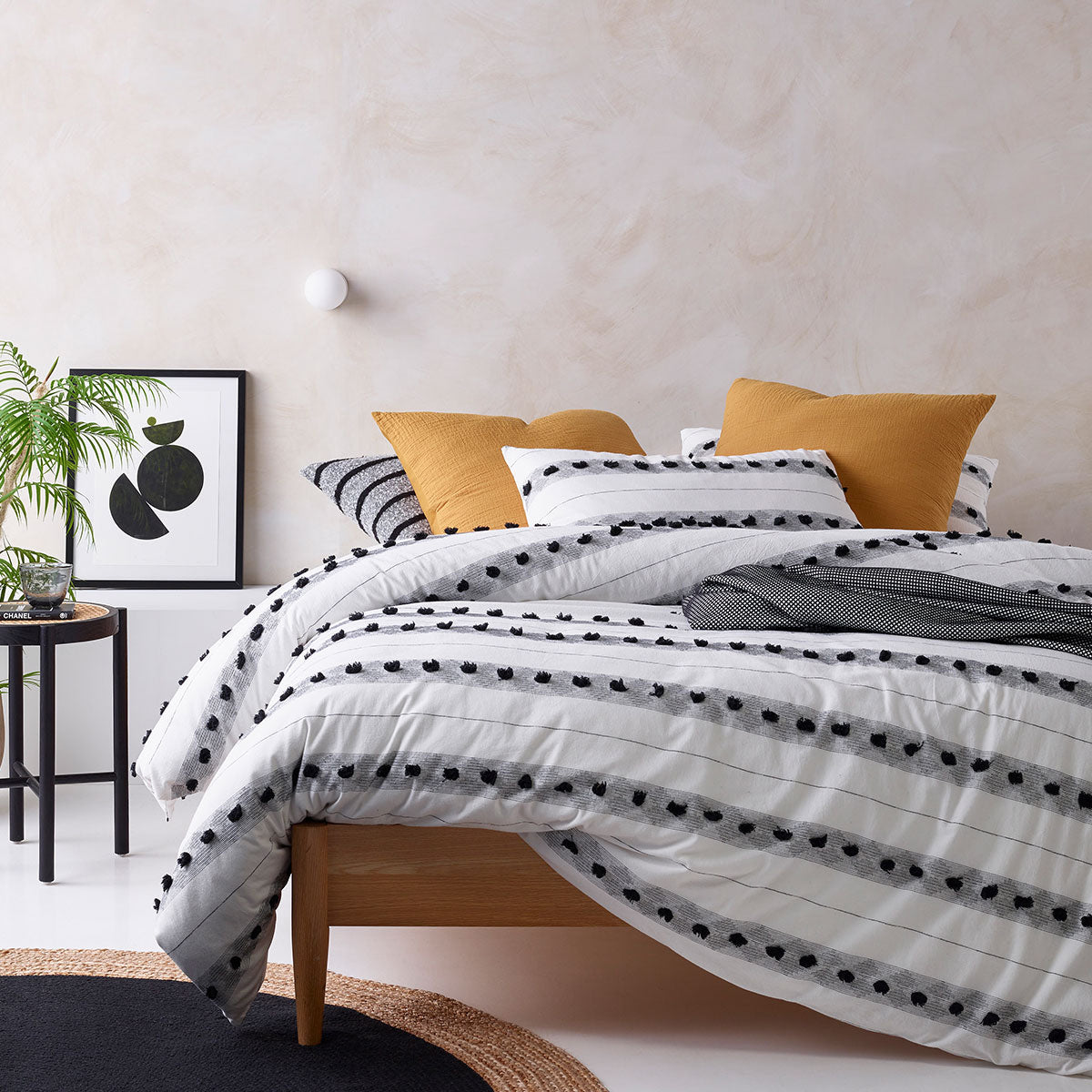 Vintage Design Homewares Serapian Cotton Quilt Cover Set featuring a chic stripe pattern in soft neutral tones of black, grey, and white.
