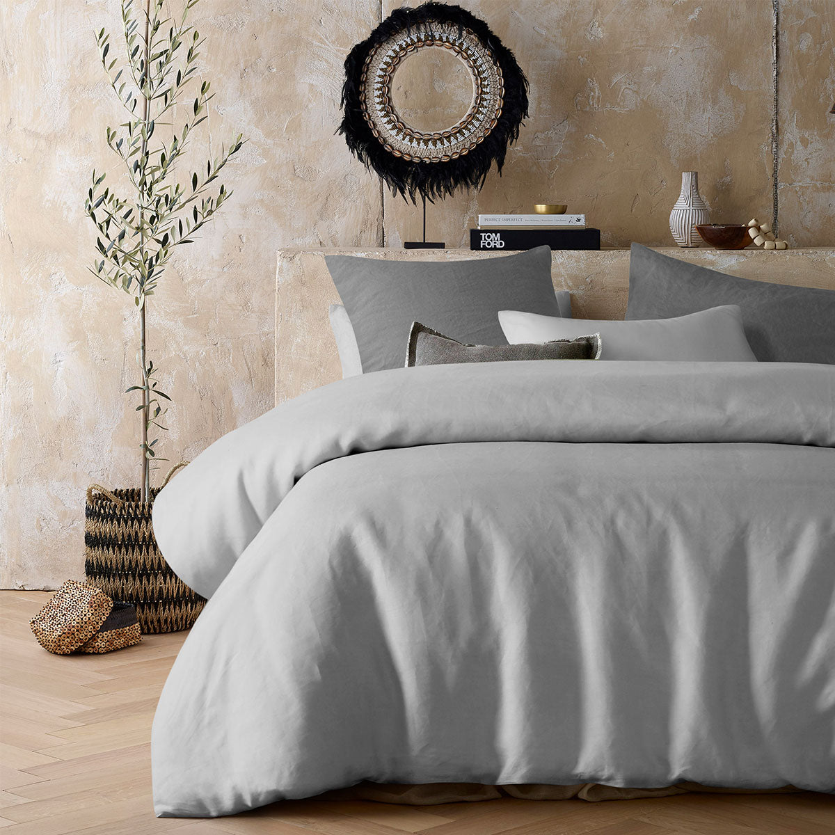 Silver 100% Hemp Quilt Cover Set displayed on a bed, showcasing its soft texture and elegant design.
