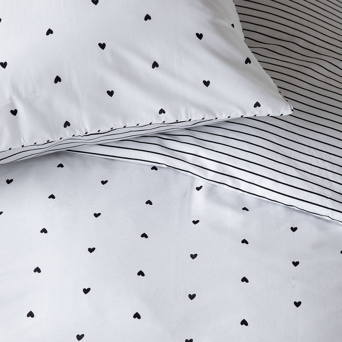 VTWonen Striped Hearts Black & White Cotton Quilt Cover Set featuring reversible heart and striped designs, perfect for king-sized beds.