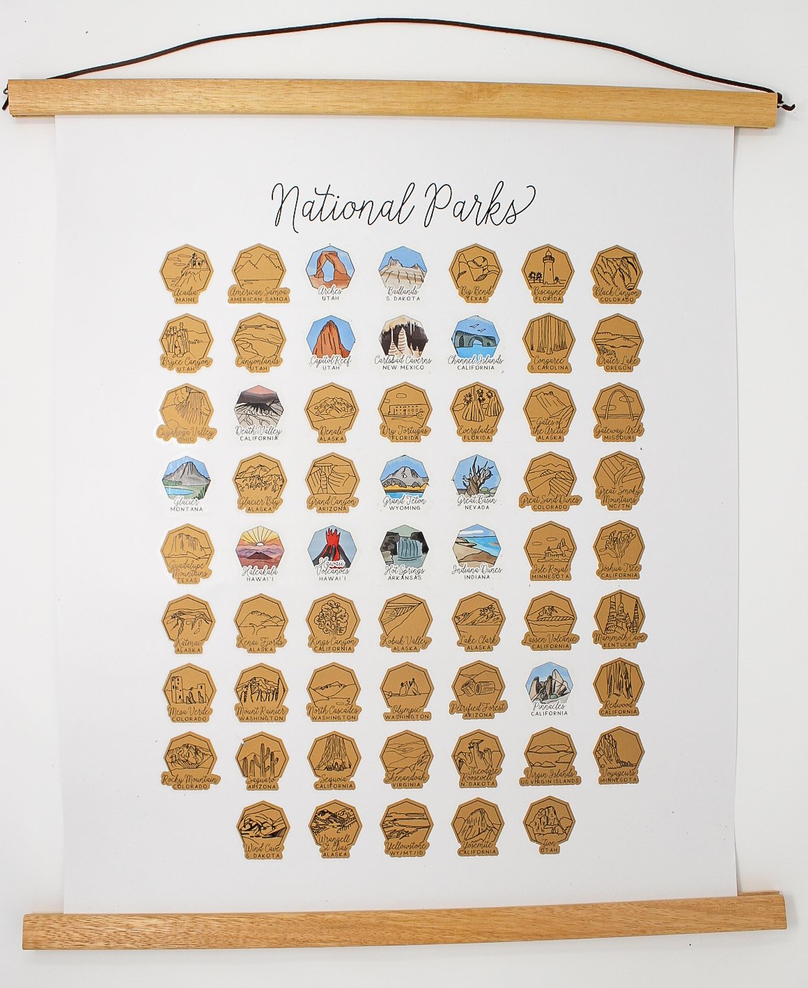 Wanderframe Magnetic Hanging Frame displaying a Scratch Your Travel Map, featuring teak wood and vegan leather string.