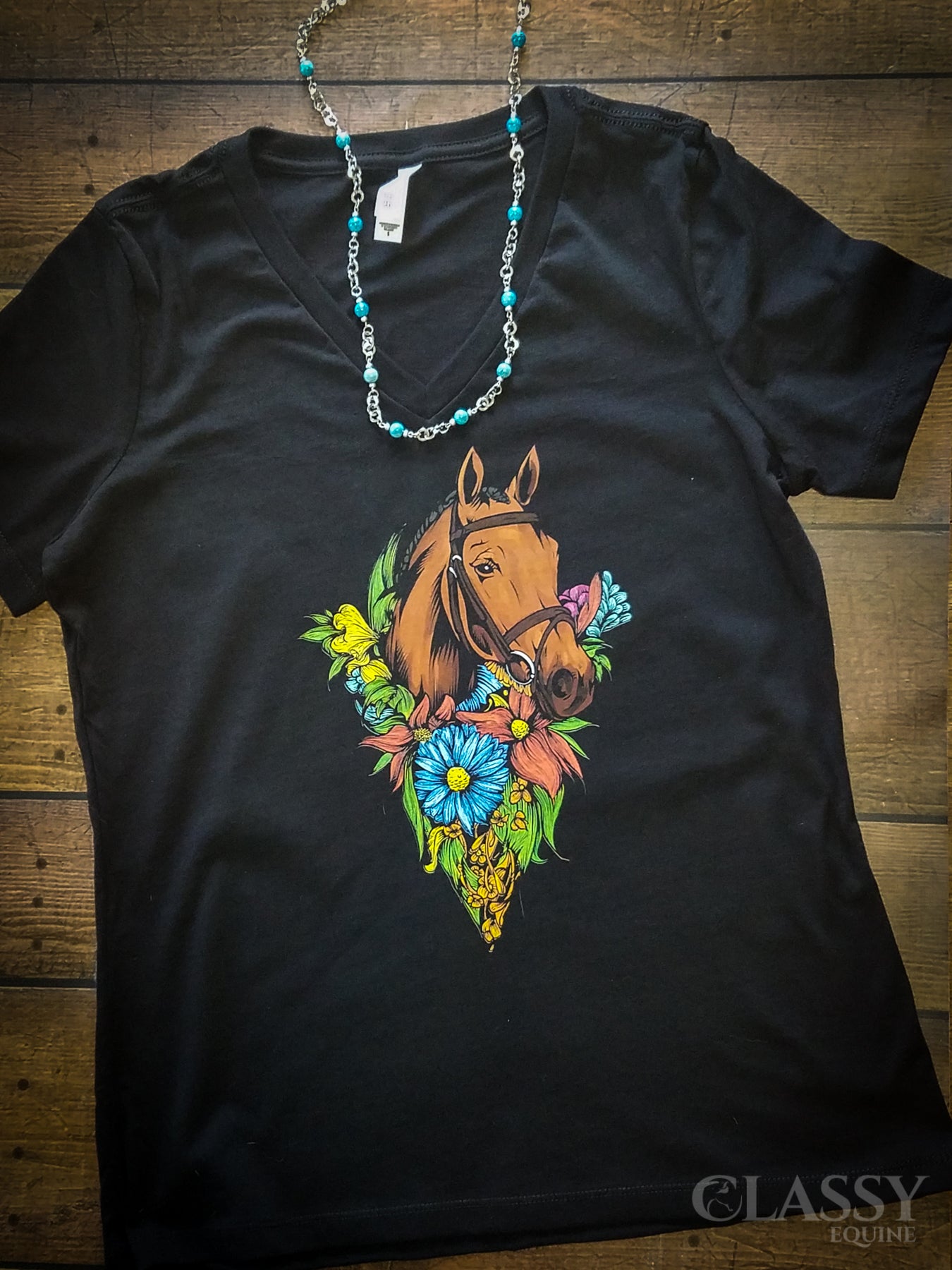 Warmblood Beauty V-Neck Tee in various colors and sizes, showcasing its relaxed fit and stylish design.