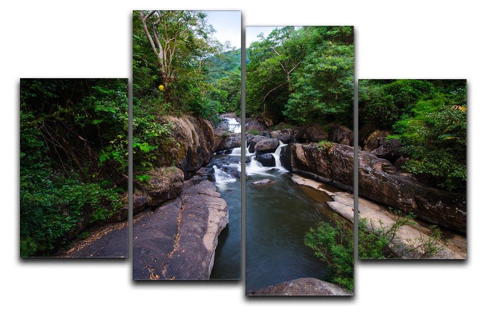 A beautiful 4-panel canvas artwork depicting a serene waterfall in a lush forest, showcasing vibrant colors and intricate details.