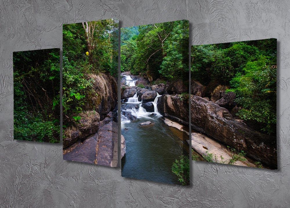 A beautiful 4-panel canvas artwork depicting a serene waterfall in a lush forest, showcasing vibrant colors and intricate details.