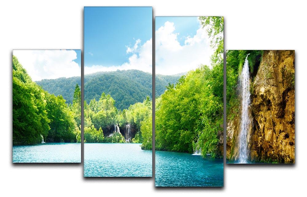 A beautiful 4 split panel canvas artwork depicting a serene waterfall in a lush green forest, showcasing vibrant colors and intricate details.