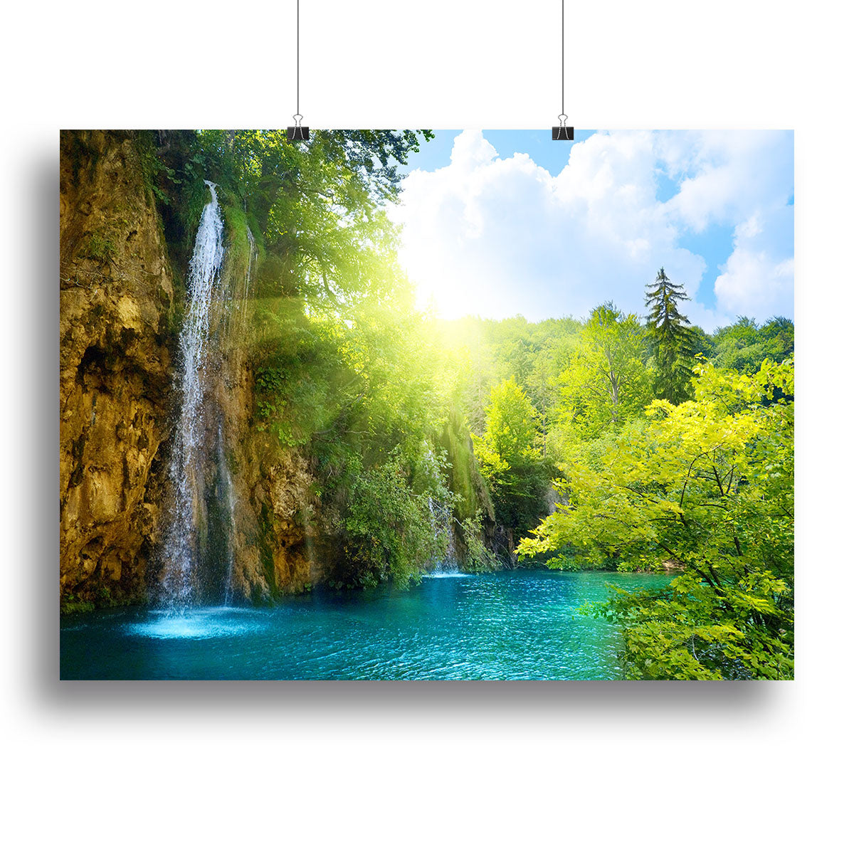 A beautiful canvas print featuring a serene waterfall in a deep forest, surrounded by lush greenery and vibrant colors.