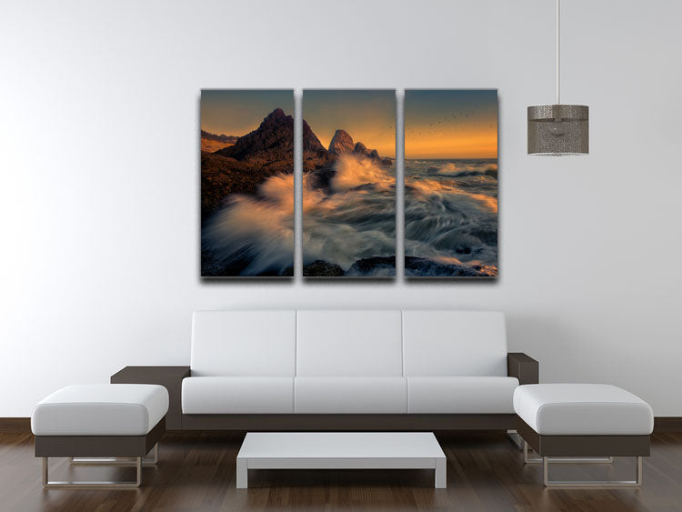 A stunning 3-panel canvas print depicting waves crashing against a cliff, showcasing vibrant colors and dynamic movement.