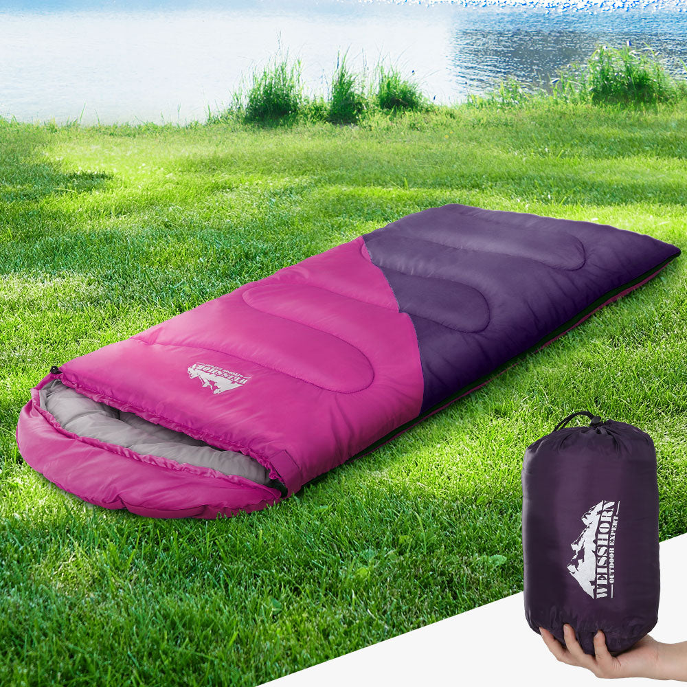Weisshorn Sleeping Bag for kids in pink, designed for camping and hiking, featuring a soft lining and adjustable strap.