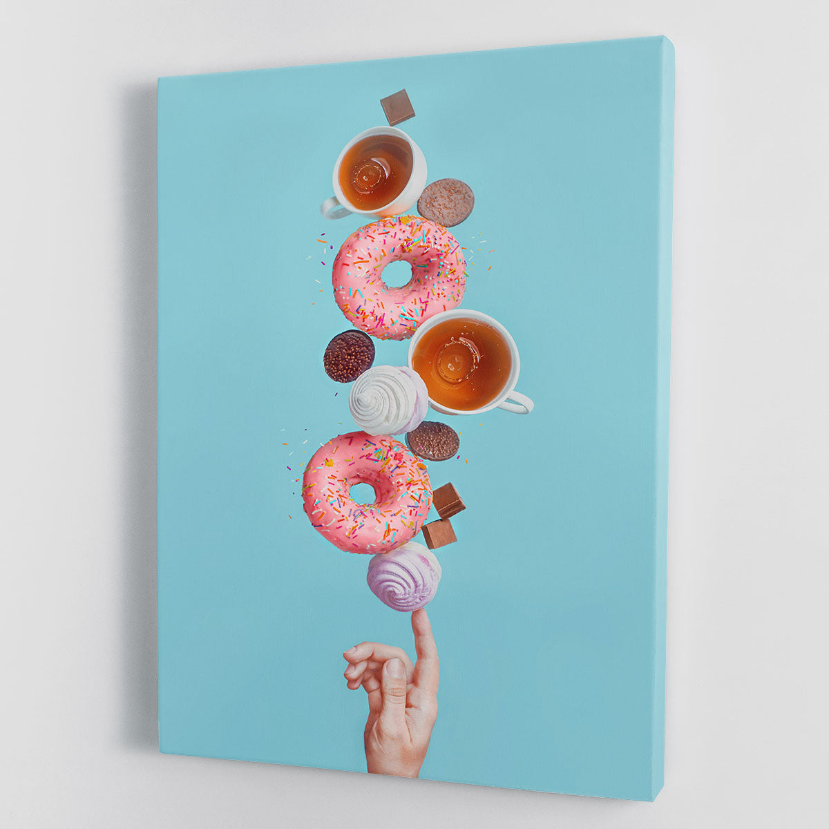 A vibrant canvas print featuring colorful donuts, perfect for home or office decor.