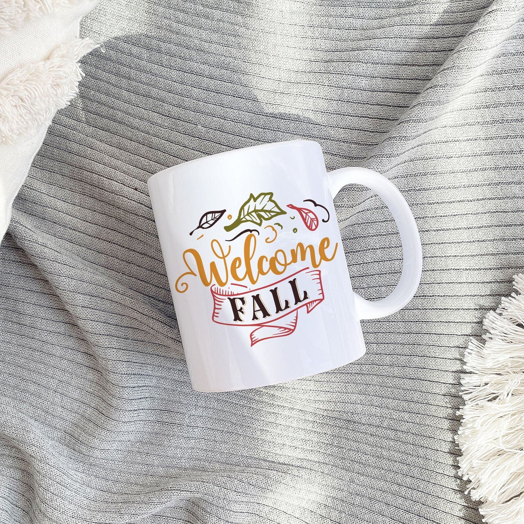 A beautifully designed Welcome Fall Mug featuring autumn-themed graphics, perfect for seasonal decor and Thanksgiving celebrations.