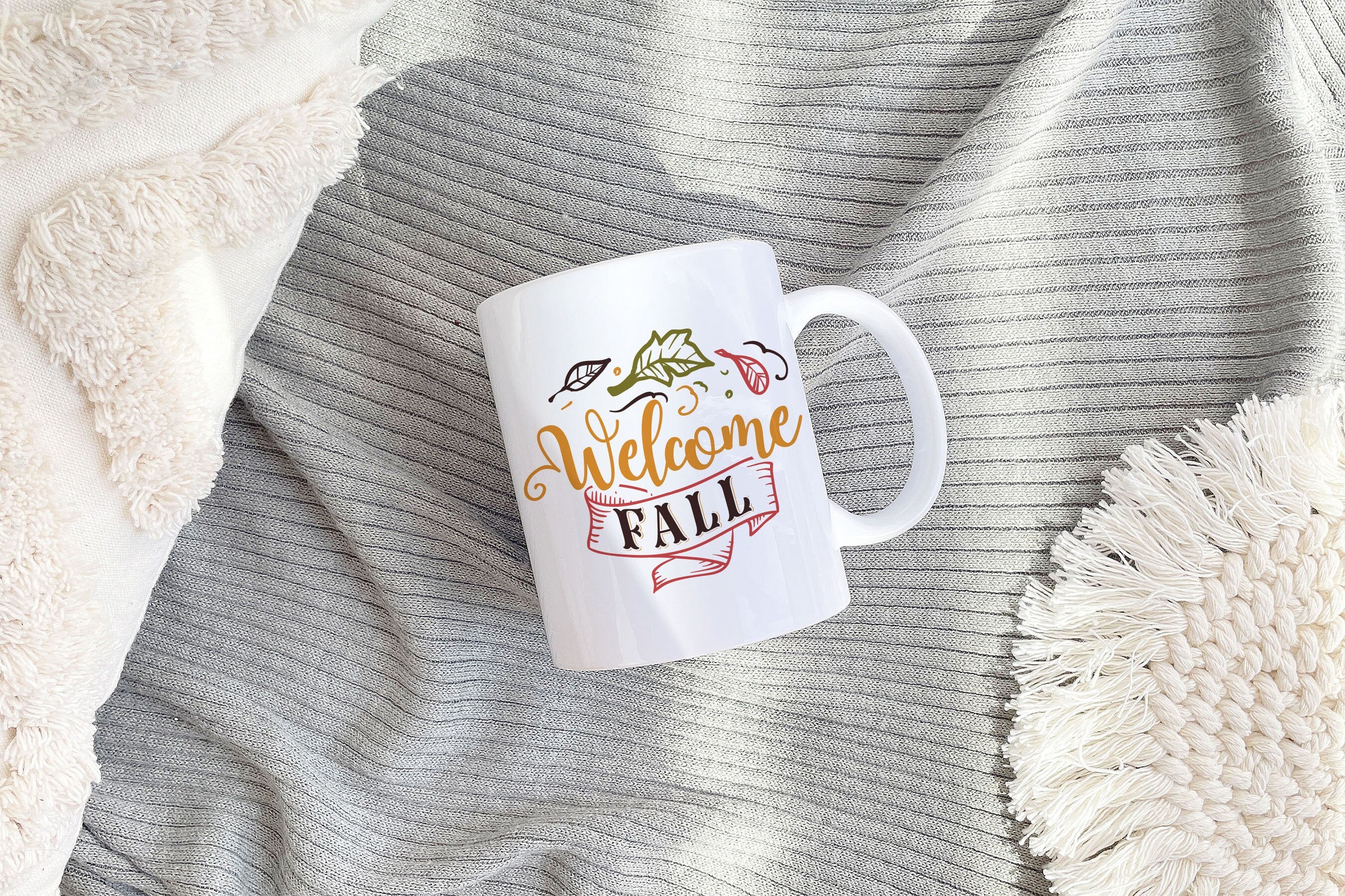 A beautifully designed Welcome Fall Mug featuring autumn-themed graphics, perfect for seasonal decor and Thanksgiving celebrations.