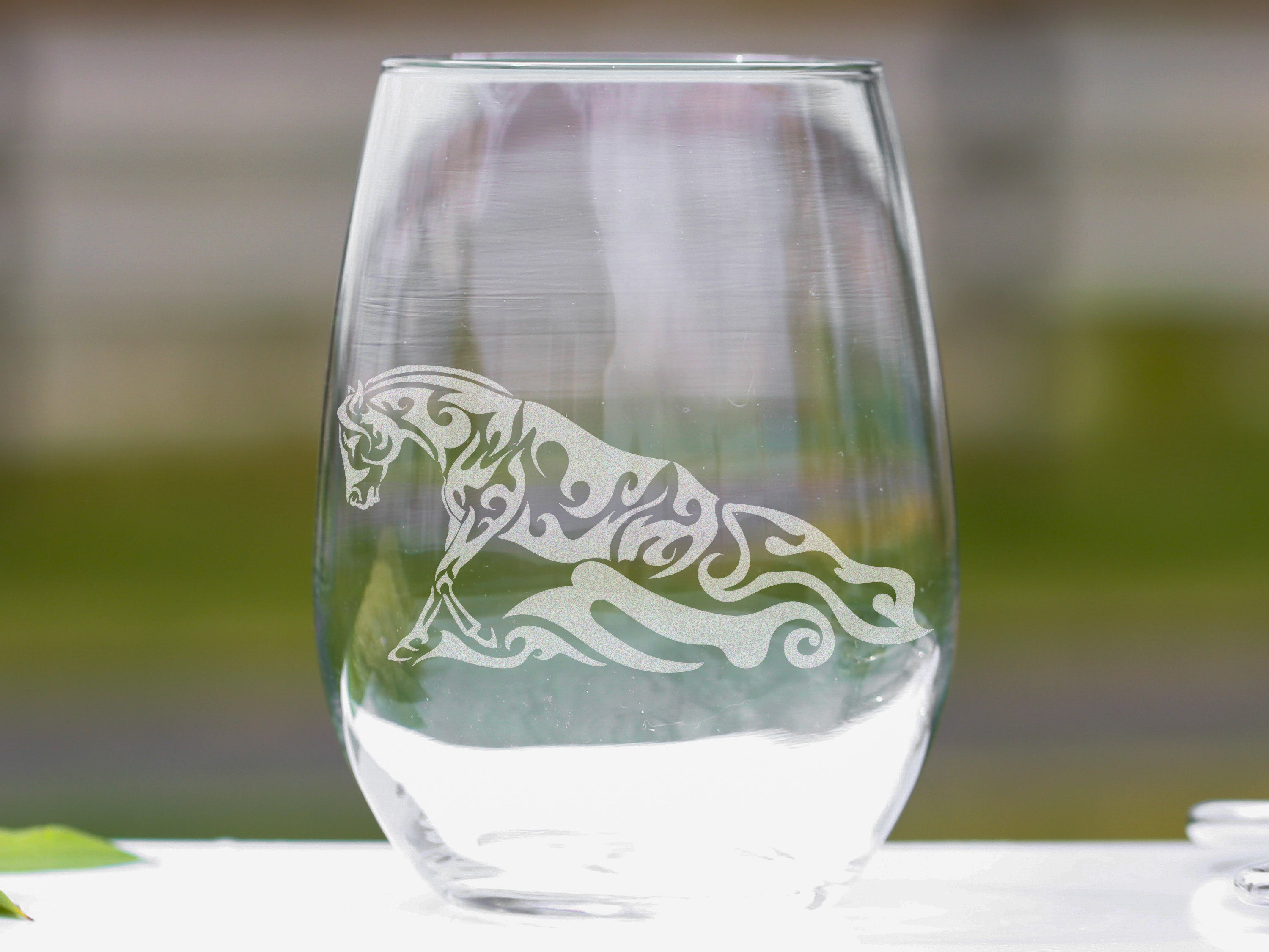 Set of Western Reining Sliding Stop Quarter Horse Wine Glasses, showcasing a reining horse design on stemless 20 oz glasses.