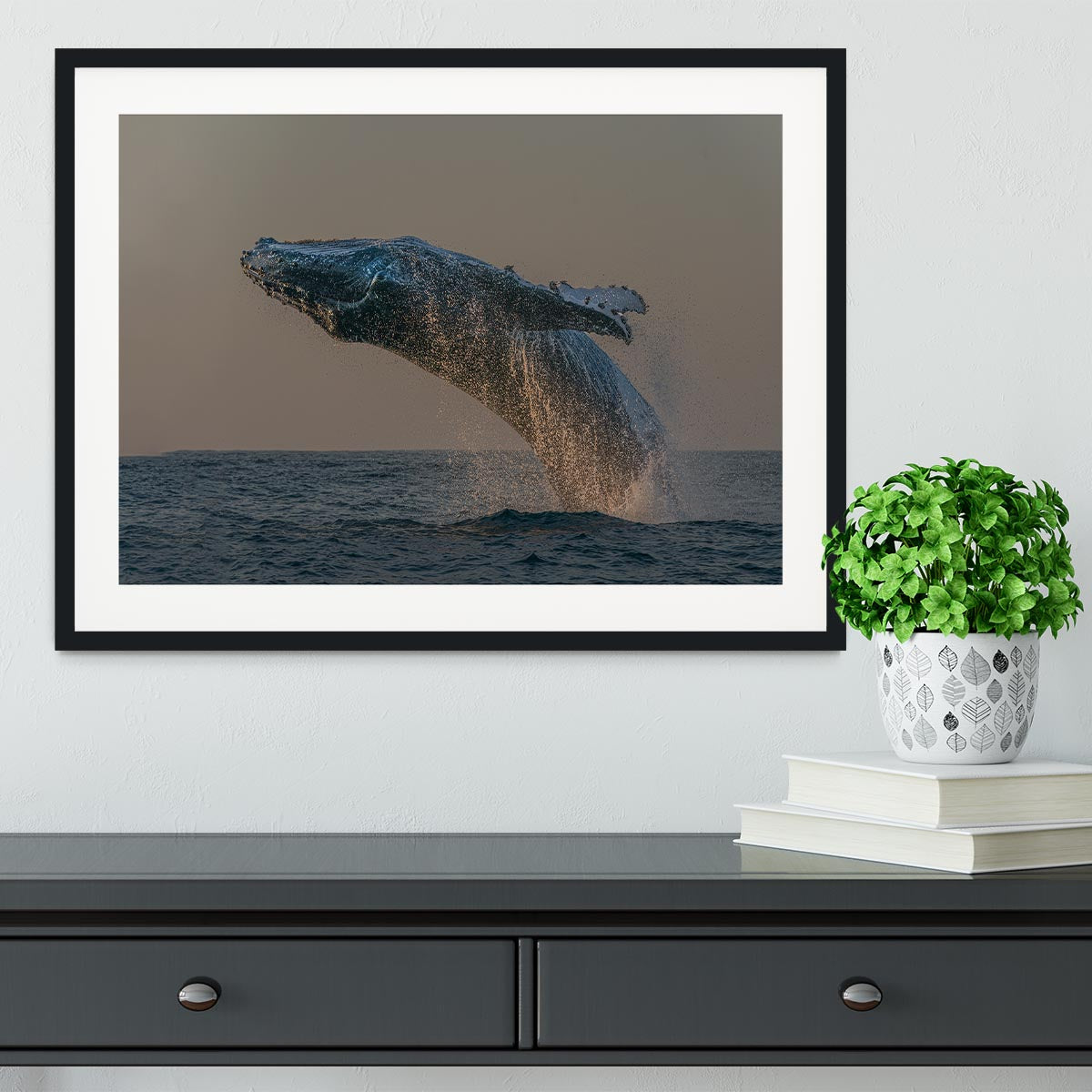 Framed print of a whale flipping out of the ocean, showcasing vibrant colors and intricate details.