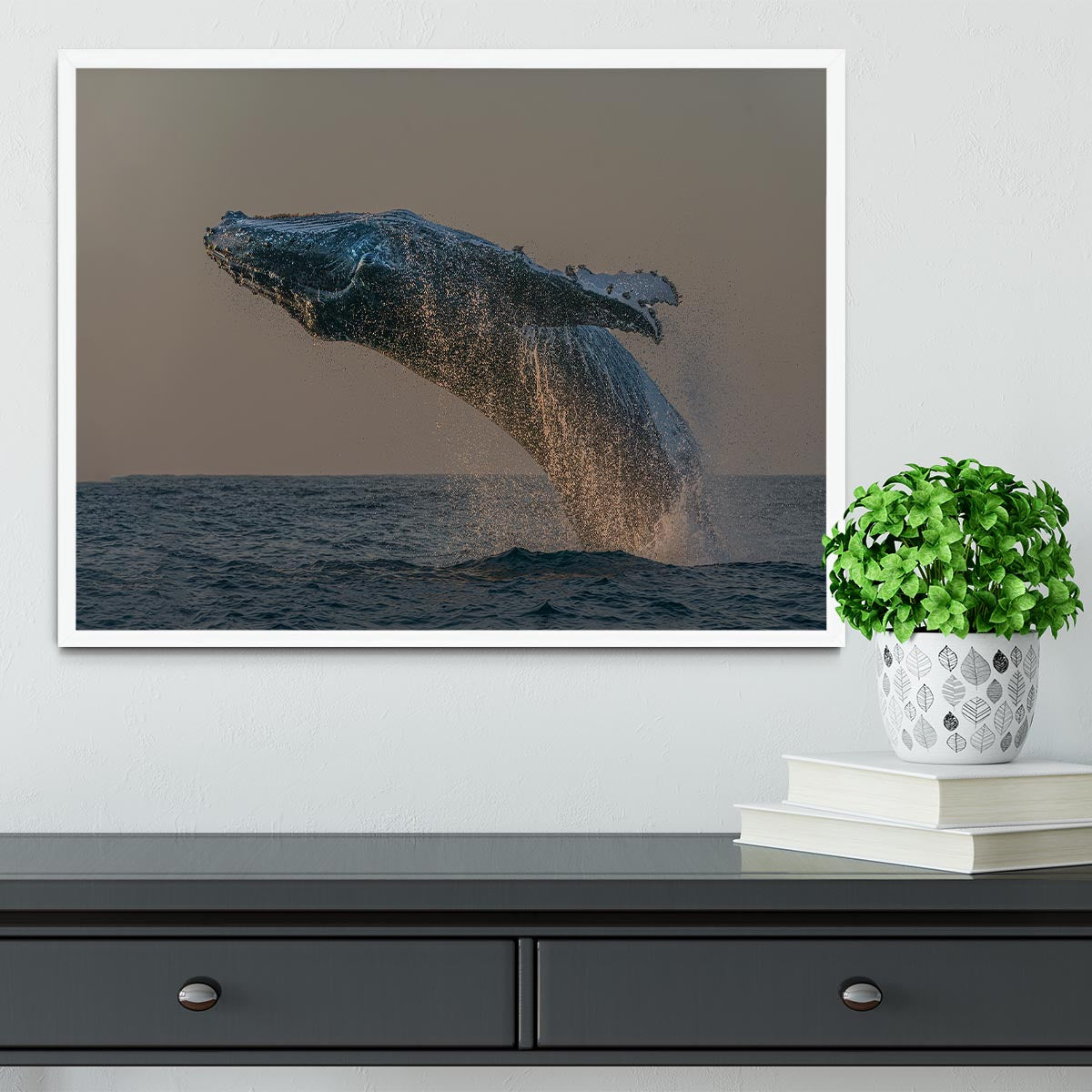 Framed print of a whale flipping out of the ocean, showcasing vibrant colors and intricate details.