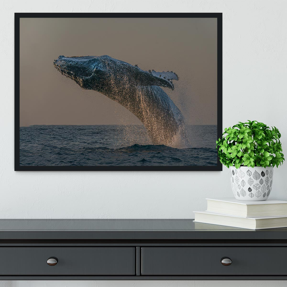 Framed print of a whale flipping out of the ocean, showcasing vibrant colors and intricate details.