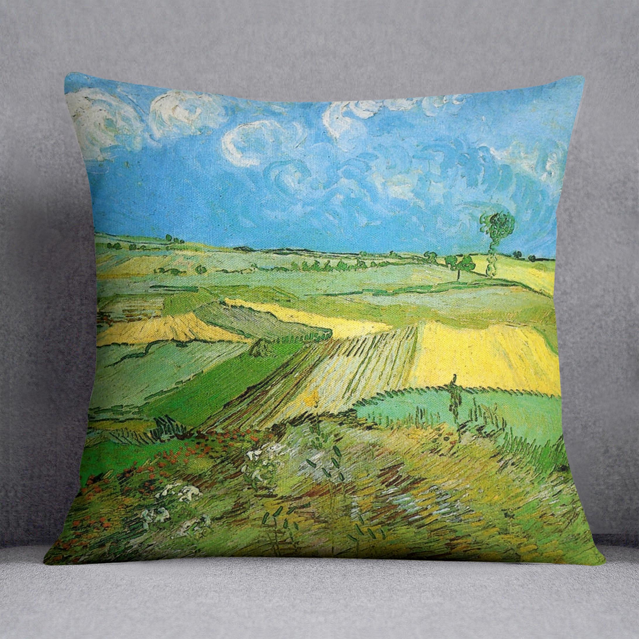 A vibrant cushion featuring Van Gogh's Wheat Fields at Auvers Under Clouded Sky artwork, made from luxurious vegan faux suede.
