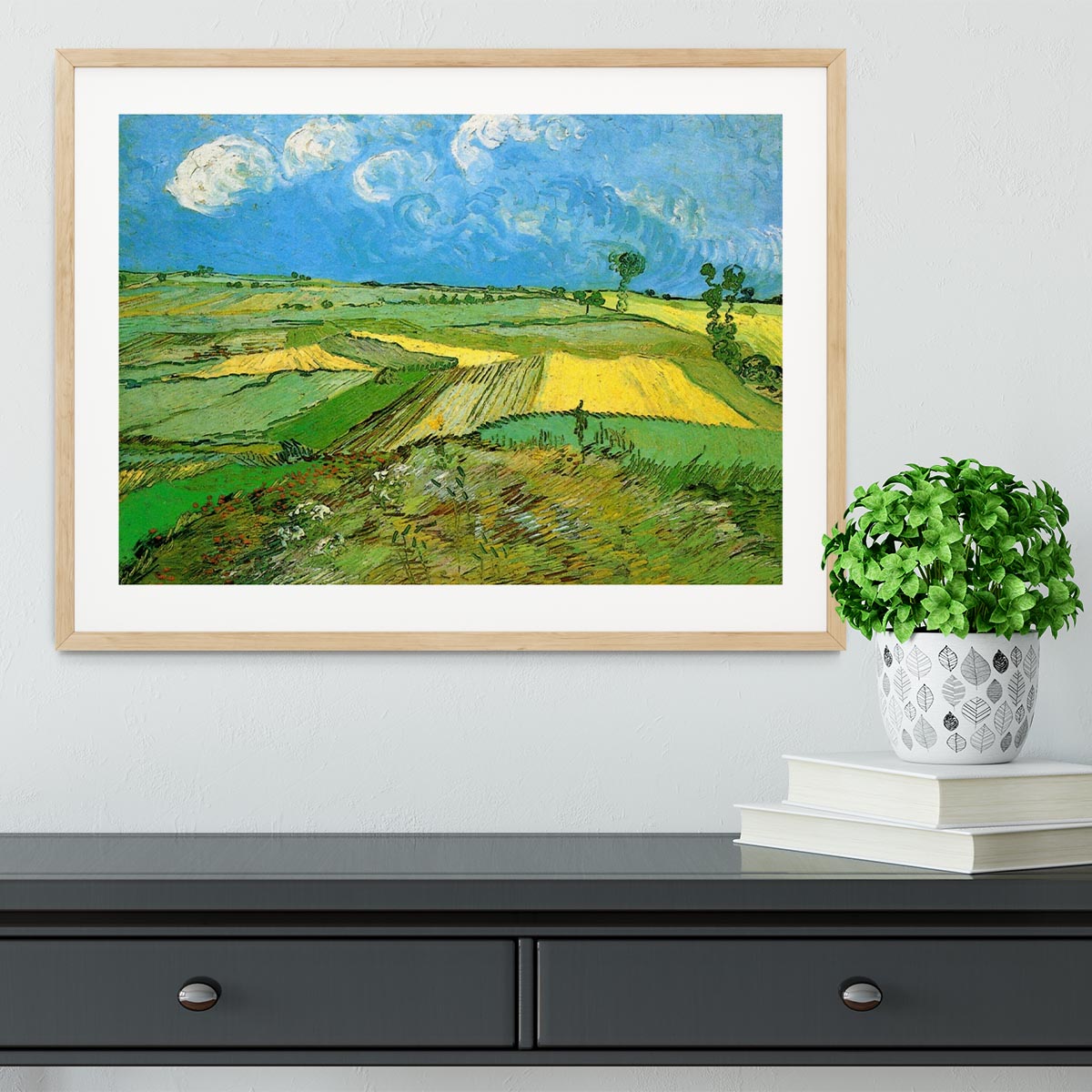 Framed print of Wheat Fields at Auvers Under Clouded Sky by Van Gogh, showcasing vibrant colors and dynamic brush strokes.