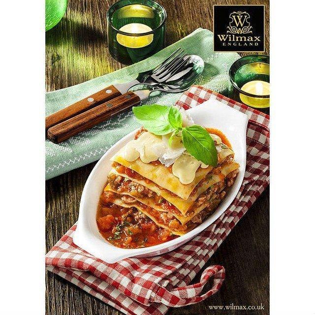 A 9-inch oval white baking dish made of fine porcelain, showcasing its elegant design and sturdy construction.