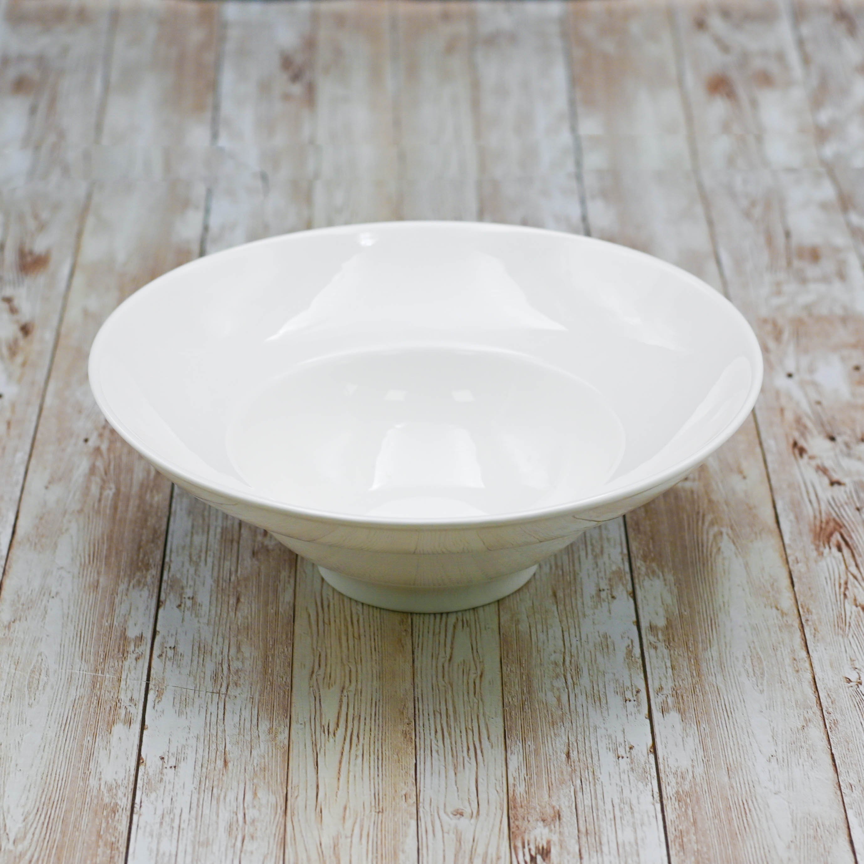 A 12-inch white deep salad or soup plate made of fine porcelain, showcasing an elegant rolled rim design.