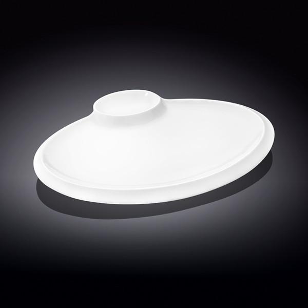 Elegant white oval platter with sauce compartment, perfect for serving various dishes.