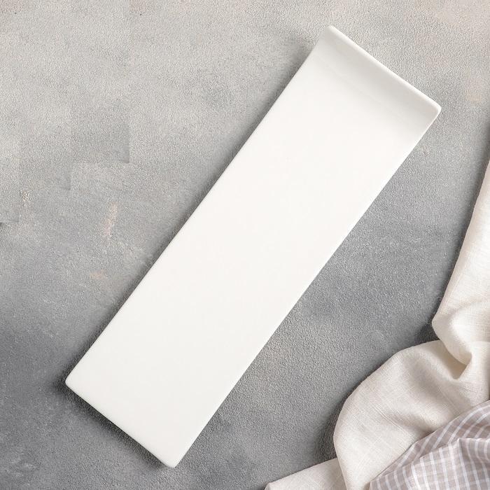 Elegant white rectangular sushi dish measuring 12 inches by 4 inches, perfect for modern dining and culinary presentations.