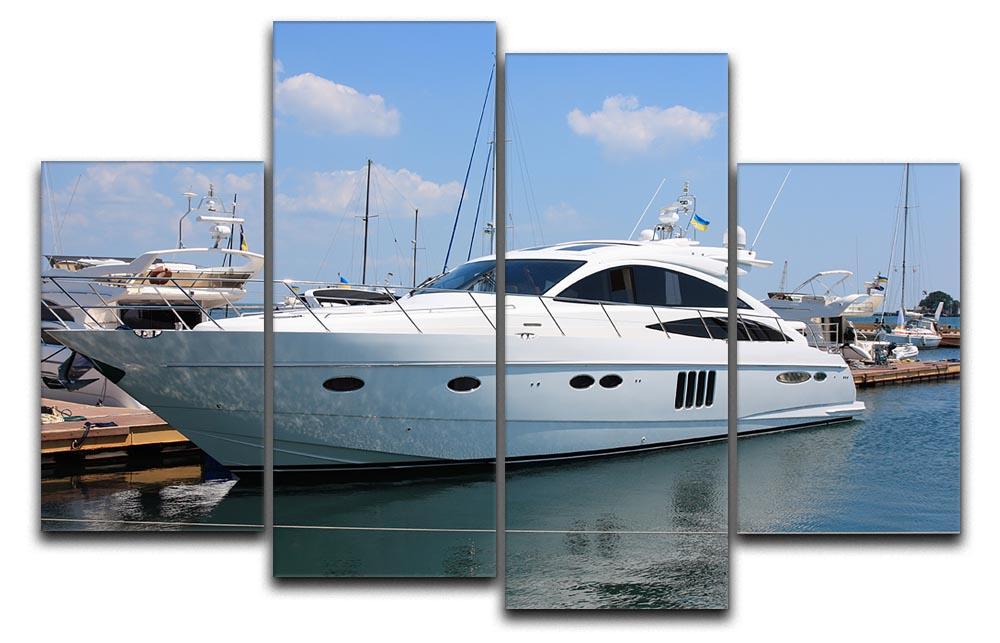 A beautiful white yacht docked in a marina, depicted in a four-panel split canvas artwork, showcasing vibrant colors and serene water.