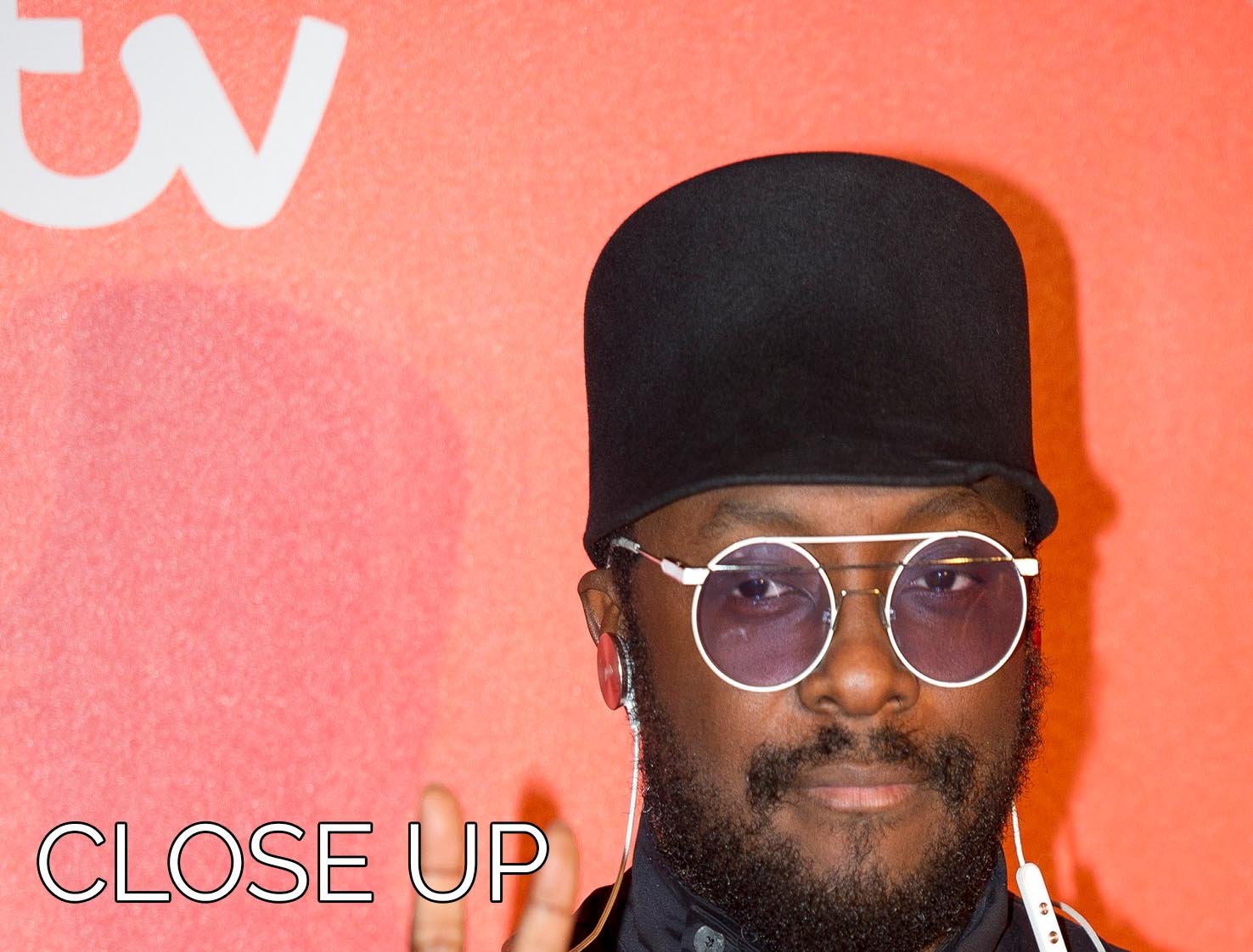 Three-panel canvas print featuring Will I Am in a stylish hat, perfect for modern decor.