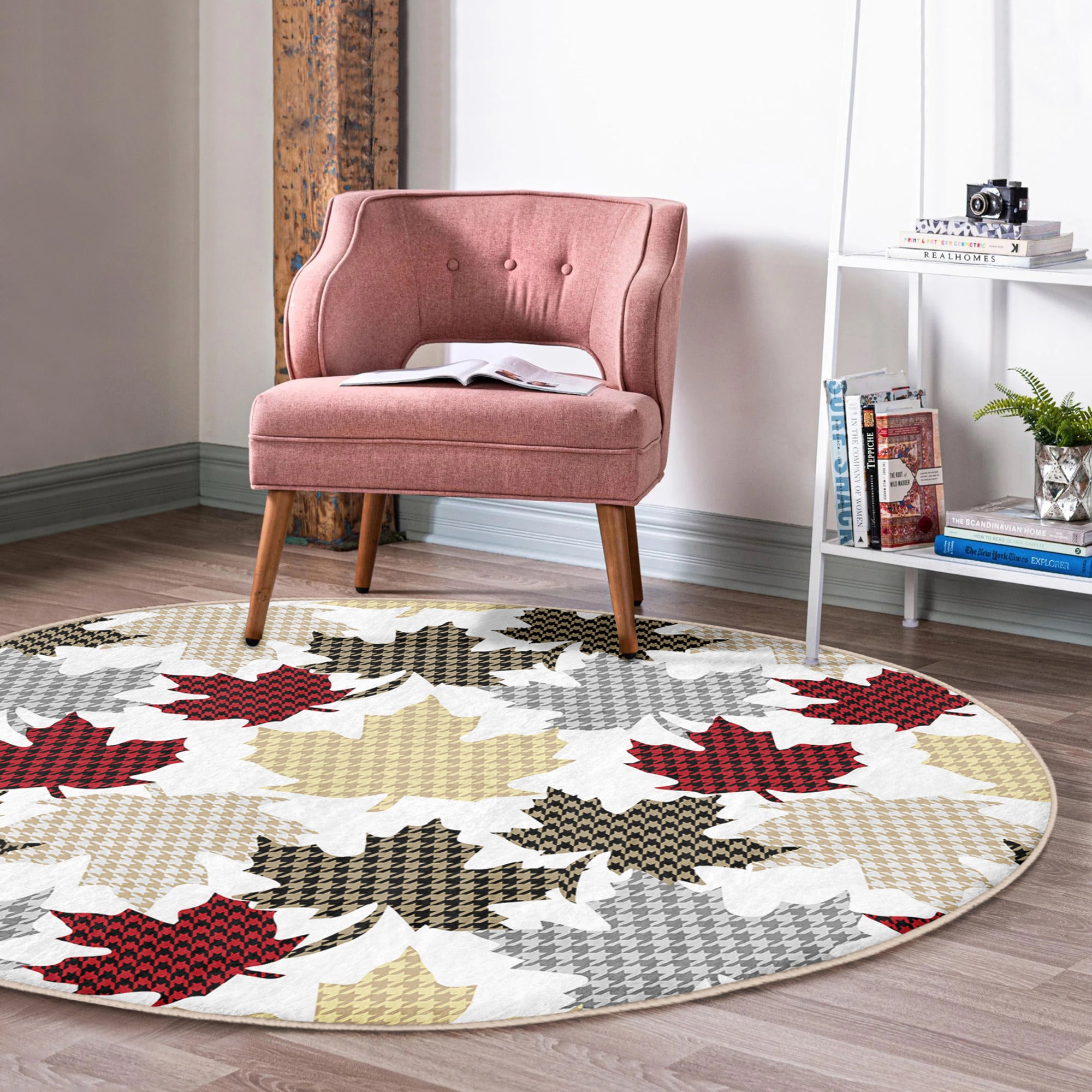 A cozy round rug featuring a vibrant maple leaf pattern, perfect for winter home decor, showcasing rich colors and soft texture.