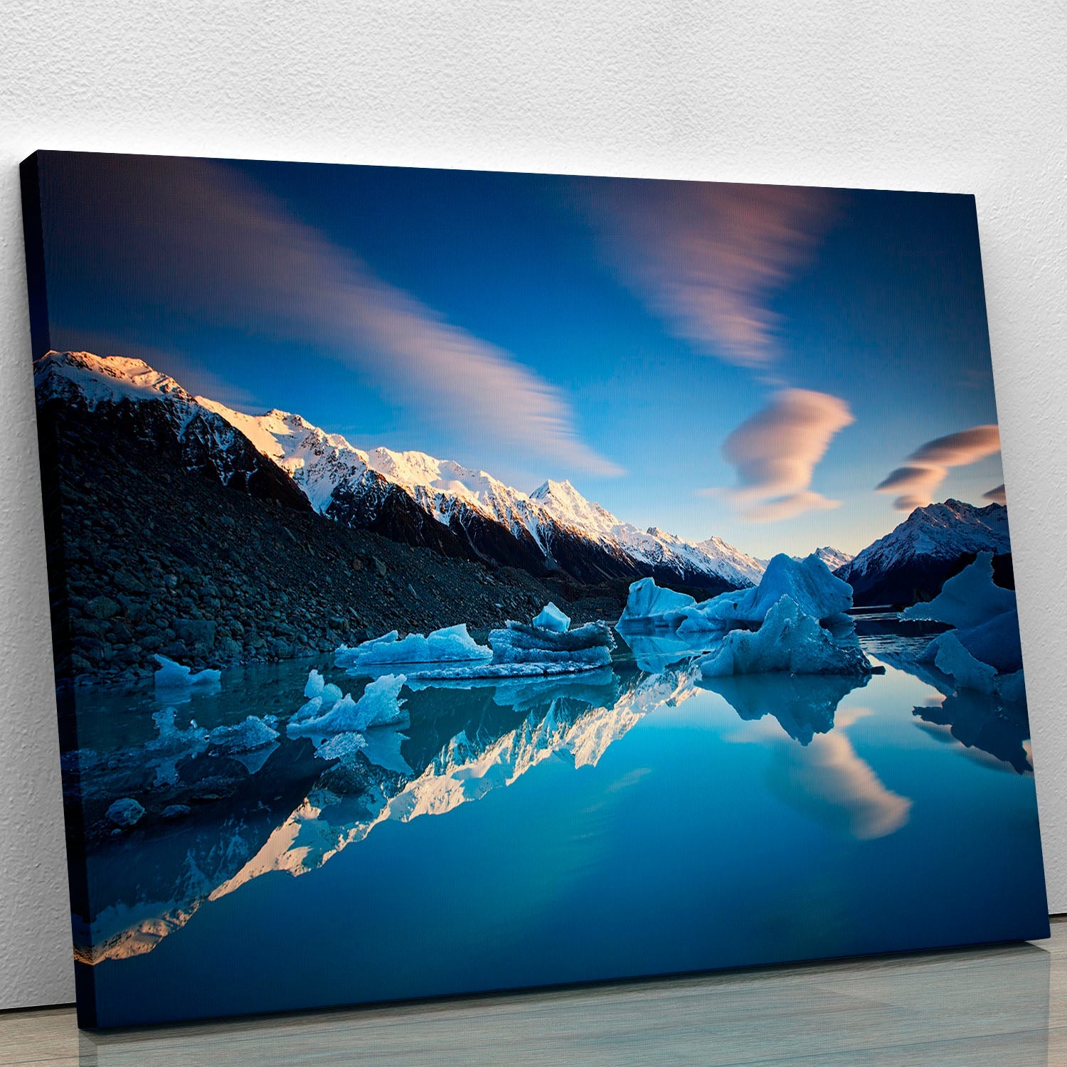 A beautiful Winter Symmetry Canvas Print showcasing a serene winter landscape with snow-covered trees and a tranquil atmosphere.