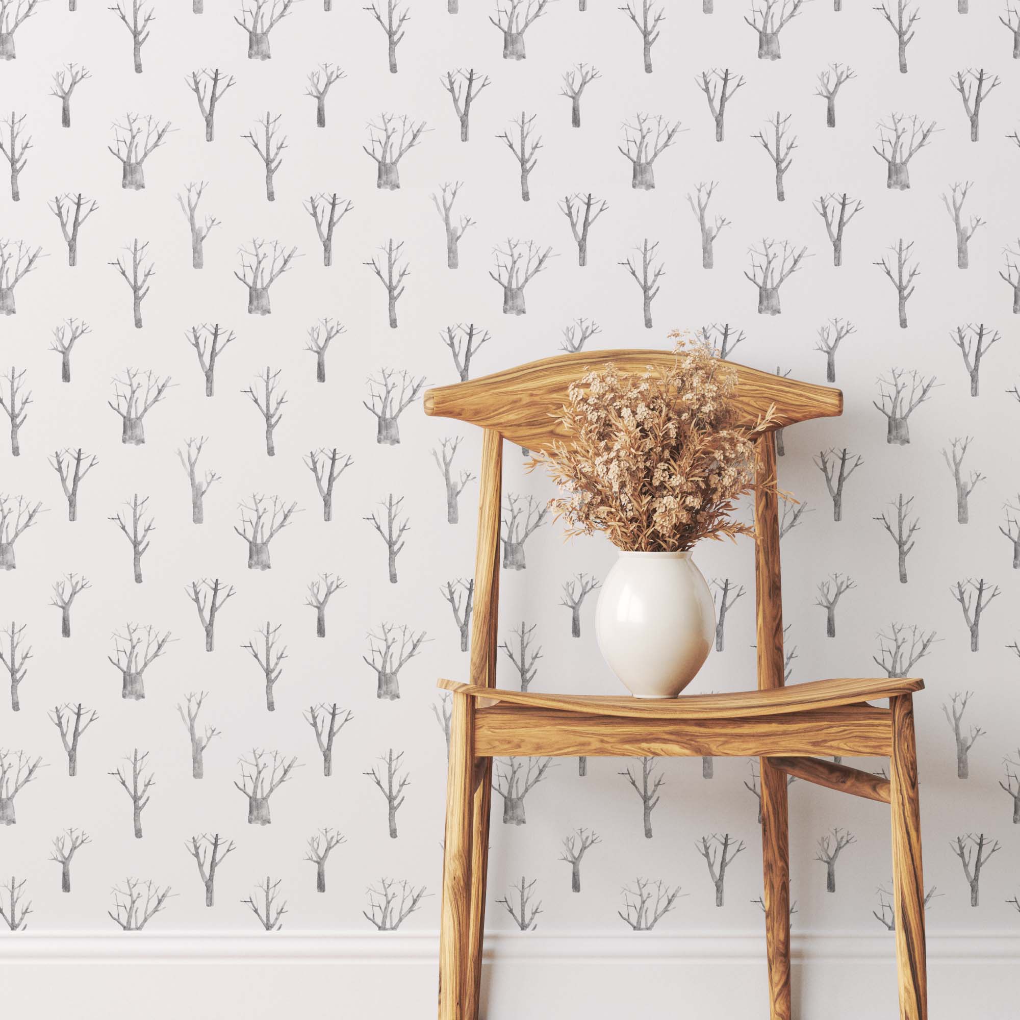 Elegant winter trees wallpaper in soothing white and grey tones, perfect for nursery bedrooms.