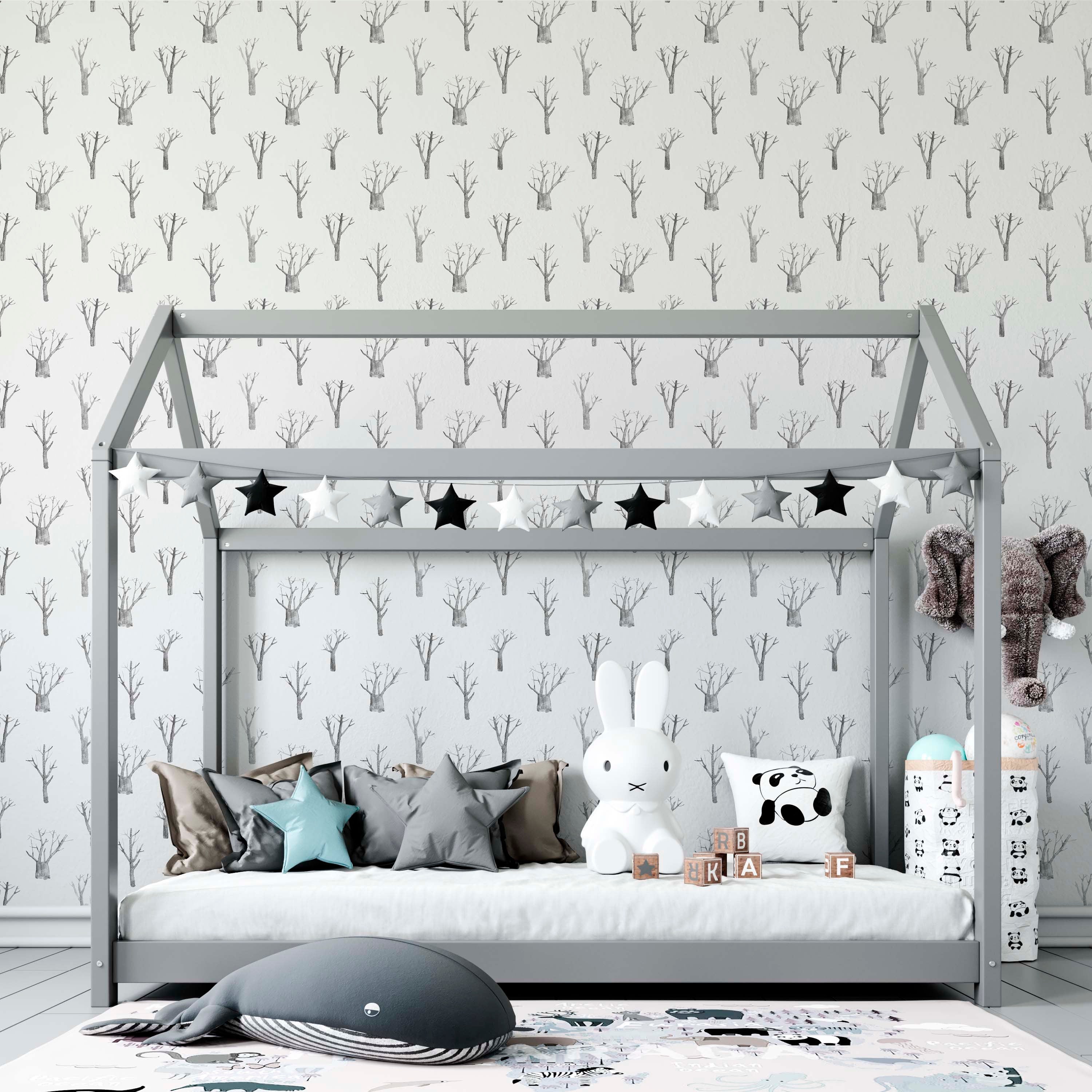 Elegant winter trees wallpaper in soothing white and grey tones, perfect for nursery bedrooms.
