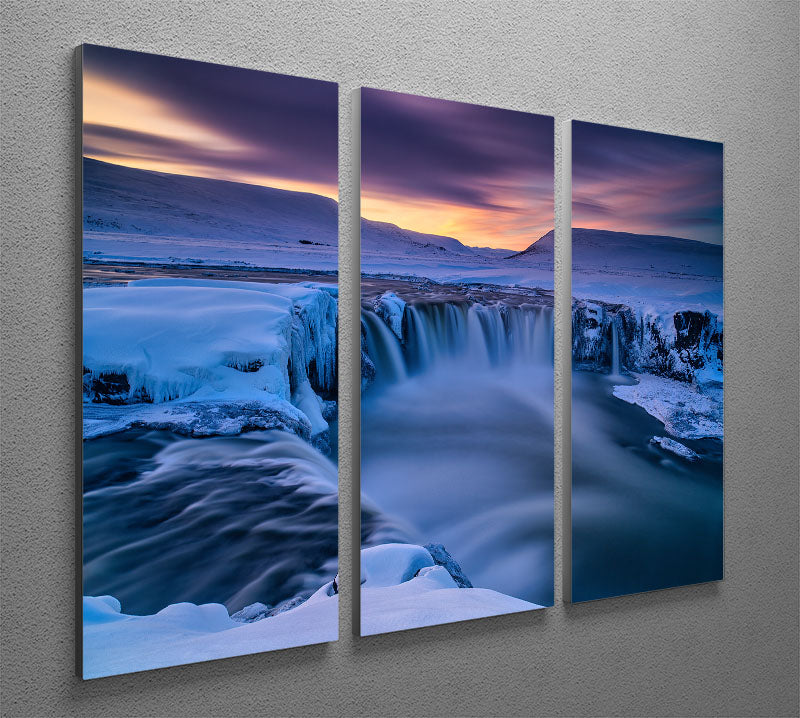 A beautiful 3-panel canvas print featuring a serene wintry waterfall scene, perfect for home decor.