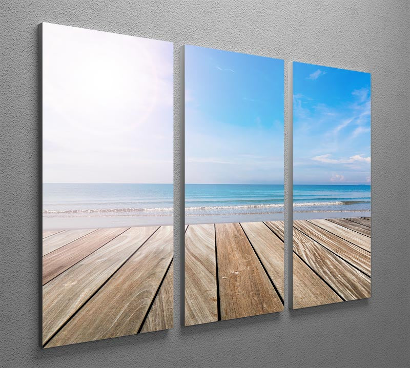 A stunning 3-panel canvas print depicting a serene wood terrace on the beach, perfect for home decor.