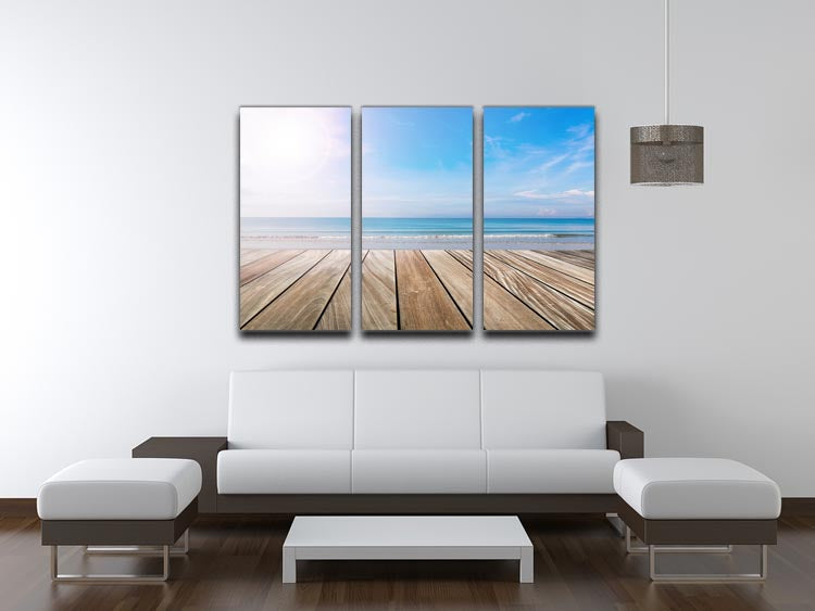 A stunning 3-panel canvas print depicting a serene wood terrace on the beach, perfect for home decor.