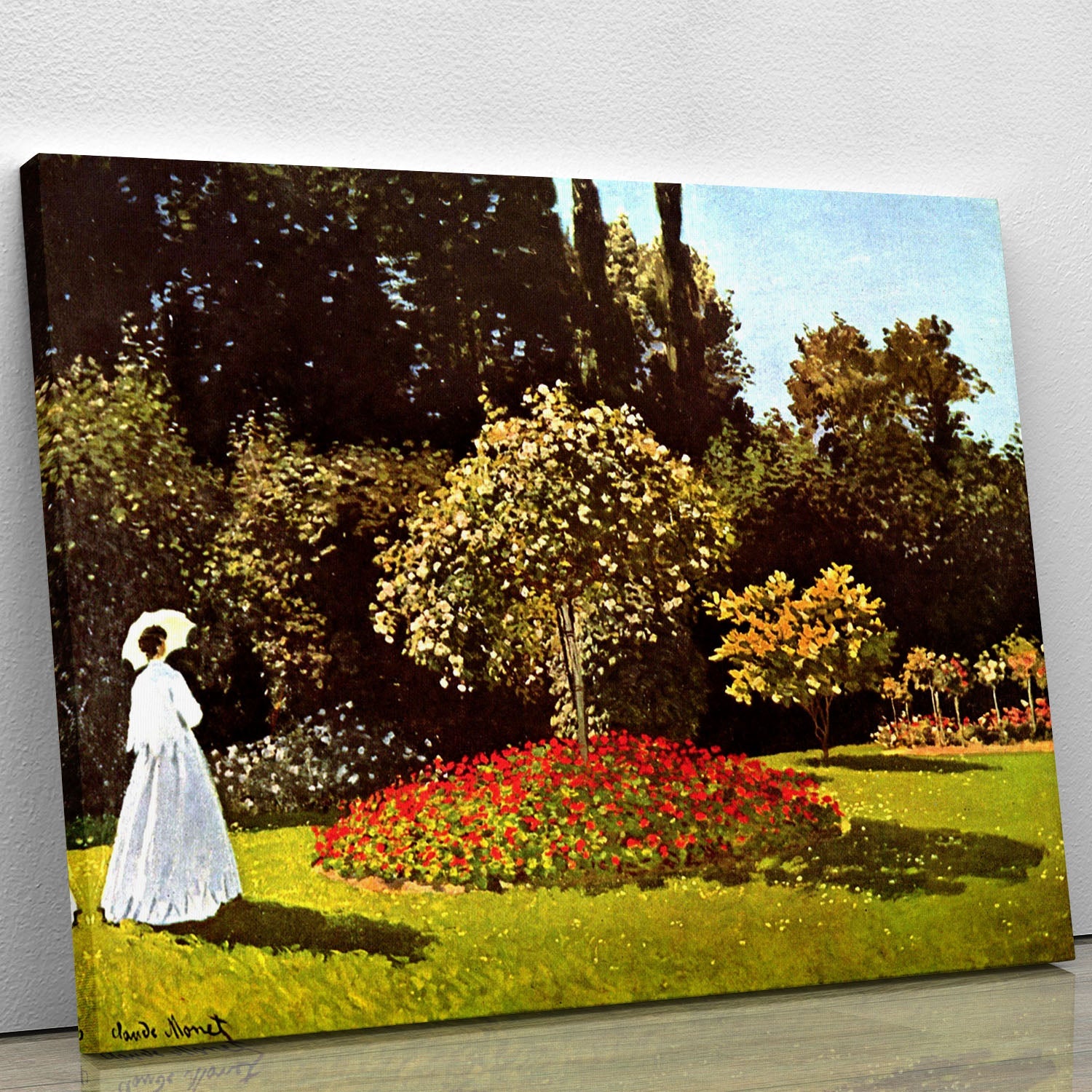 Canvas print of Woman in the Garden by Monet, featuring a woman in a white dress surrounded by colorful flowers in a lush garden.