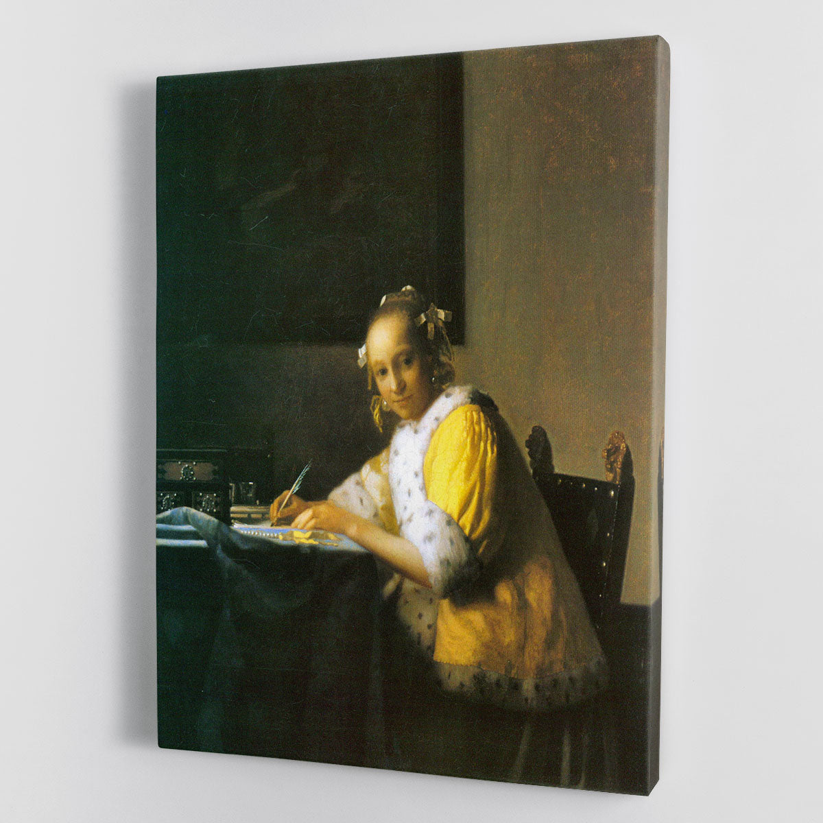 Canvas print of Vermeer's 'Woman in Yellow', showcasing a woman in a yellow gown with intricate details and vibrant colors.